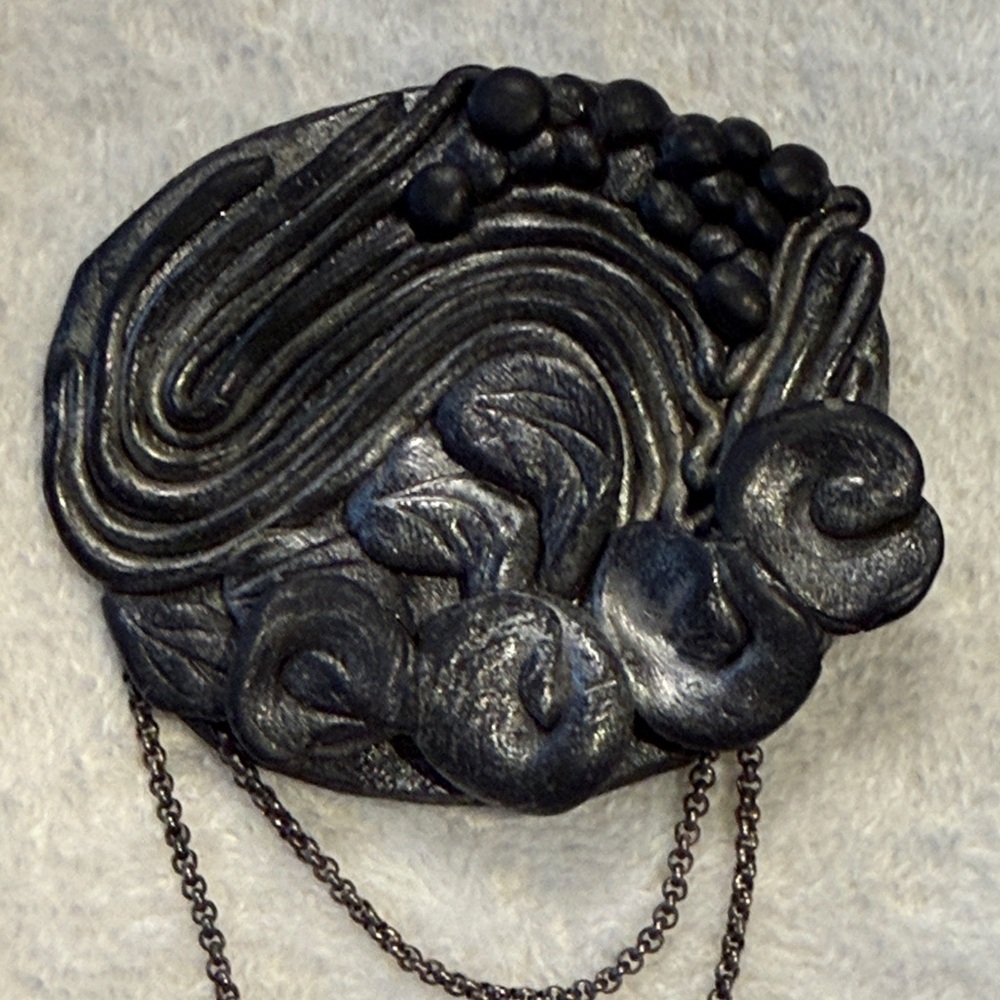 Elegant Black/Pewter Brooch with Chain Detail